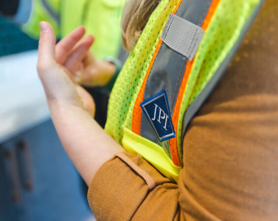 Construction worker points to something interesting