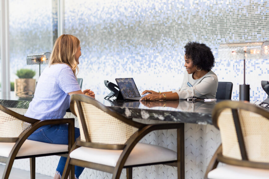 Two JPI employees working at a desk