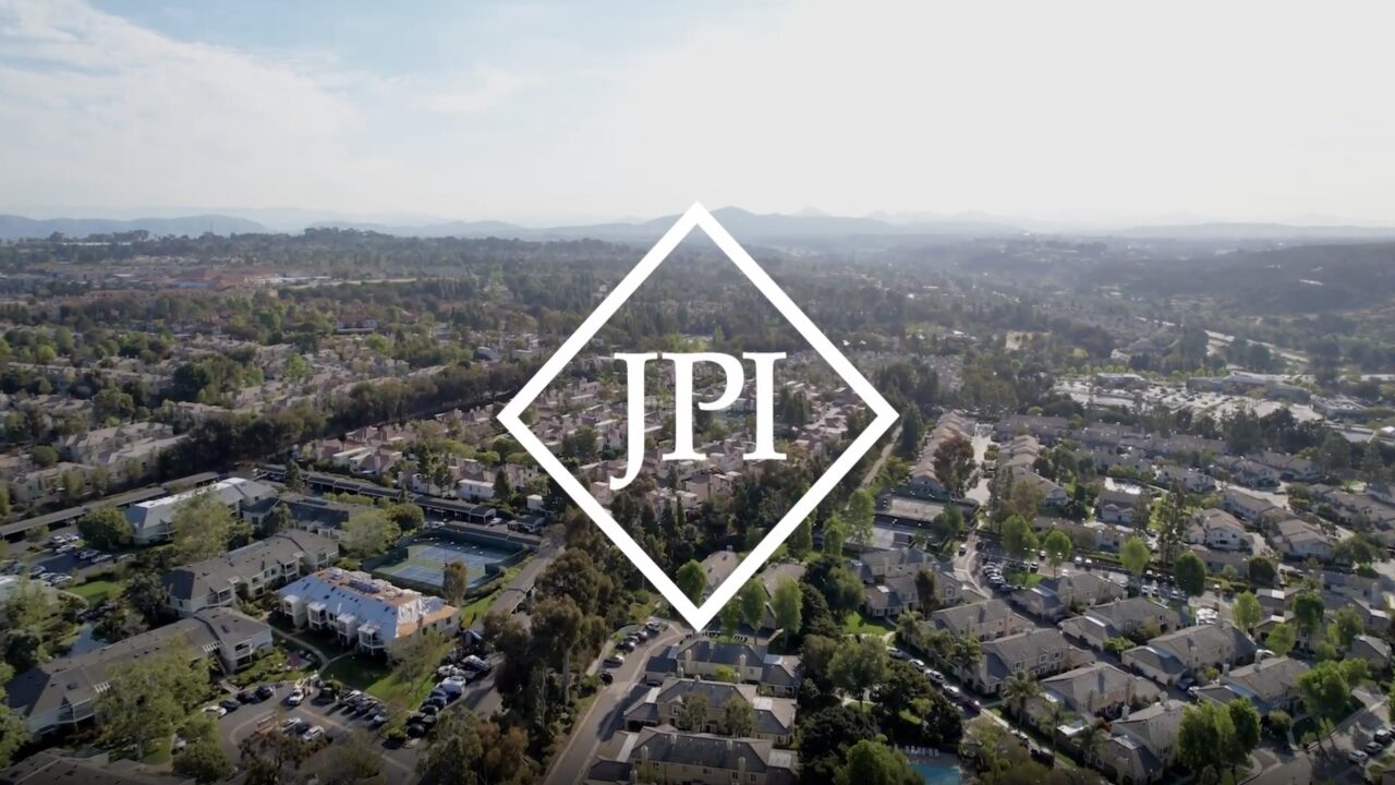 JPI logo with city in background