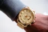 Gold watch on man's wrist
