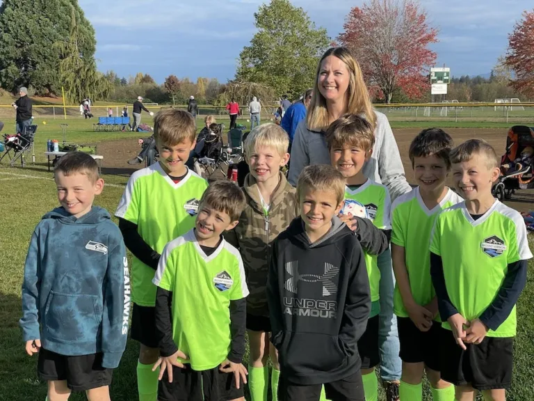 Rachel with a kids soccer team